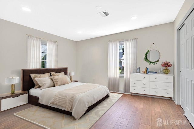 495 Newport Way Unit B, Monroe, NJ 08831 - bedroom with multiple windows, visible vents, and light wood-style floors