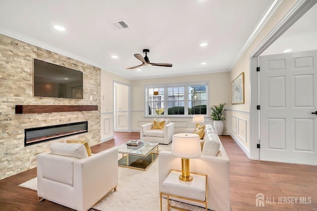 495 Newport Way Unit B, Monroe, NJ 08831 - living room with visible vents, wood finished floors, ceiling fan, a decorative wall, and ornamental molding