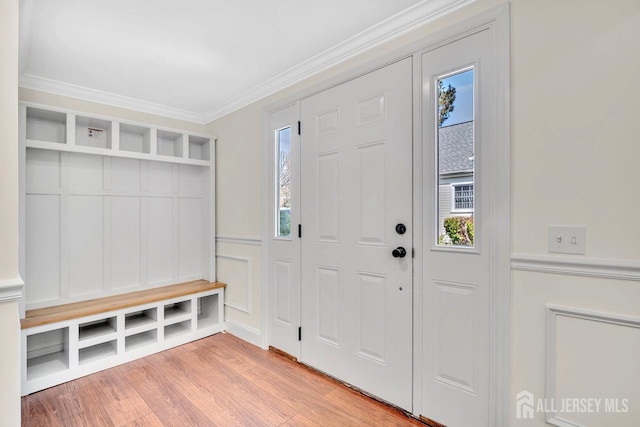 495 Newport Way Unit B, Monroe, NJ 08831 - mudroom featuring light wood-type flooring, a healthy amount of sunlight, and ornamental molding