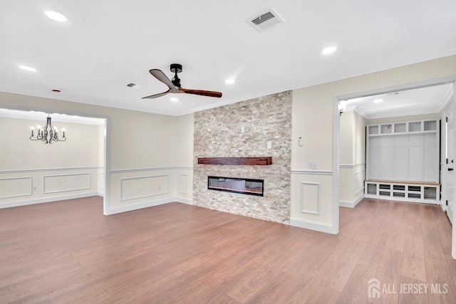 495 Newport Way Unit B, Monroe, NJ 08831 - unfurnished living room with wainscoting, visible vents, ceiling fan with notable chandelier, wood finished floors, and a decorative wall