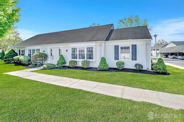 495 Newport Way Unit B, Monroe, NJ 08831 - view of front facade featuring a front lawn and roof with shingles