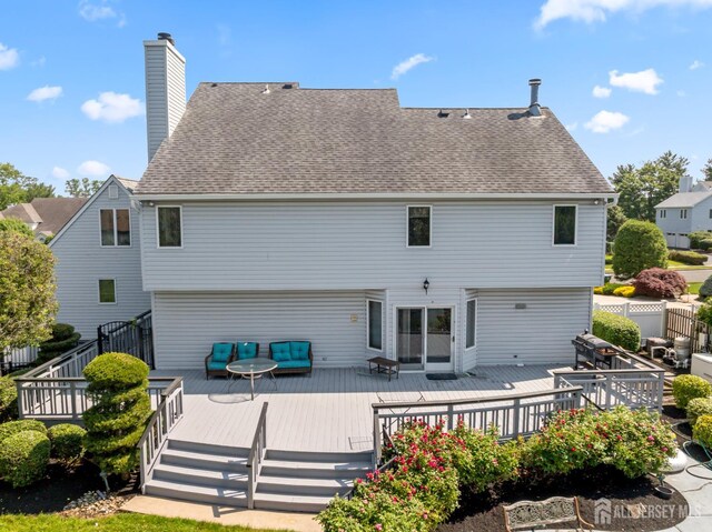 6 Allison Ct, Edison, NJ 08820 - back of property with roof with shingles, an outdoor hangout area, a chimney, and a wooden deck