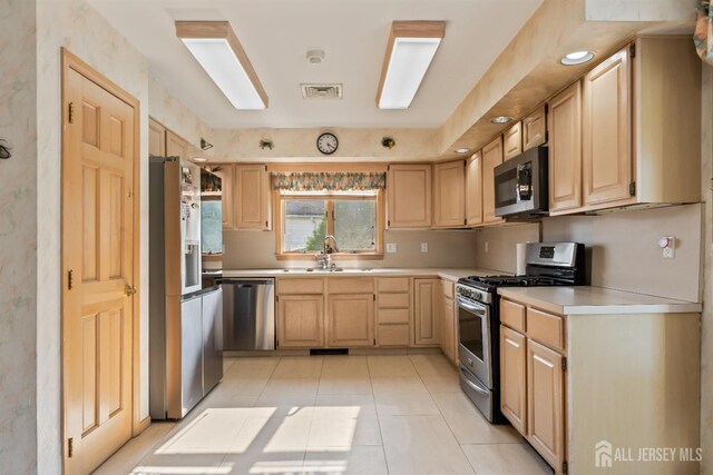 6 Allison Ct, Edison, NJ 08820 - kitchen featuring stainless steel appliances, a sink, light brown cabinets, light countertops, and light tile patterned floors