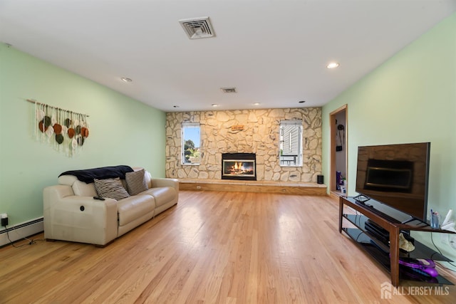 6 Allison Ct, Edison, NJ 08820 - living area featuring a fireplace, light wood-type flooring, recessed lighting, and a baseboard radiator