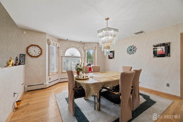 6 Allison Ct, Edison, NJ 08820 - dining room with wallpapered walls, light wood-type flooring, a chandelier, a baseboard radiator, and baseboards
