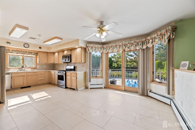 6 Allison Ct, Edison, NJ 08820 - kitchen featuring stainless steel appliances, a baseboard heating unit, light brown cabinetry, and light countertops