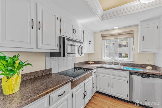 195 Mayflower Way Unit B, Monroe, NJ 08831 - kitchen featuring white cabinets, stainless steel appliances, ornamental molding, and a sink