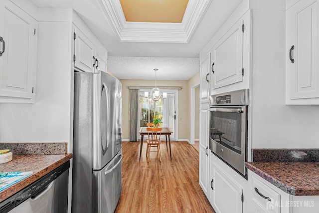 195 Mayflower Way Unit B, Monroe, NJ 08831 - kitchen with white cabinets, dark countertops, hanging light fixtures, appliances with stainless steel finishes, and light wood-style flooring