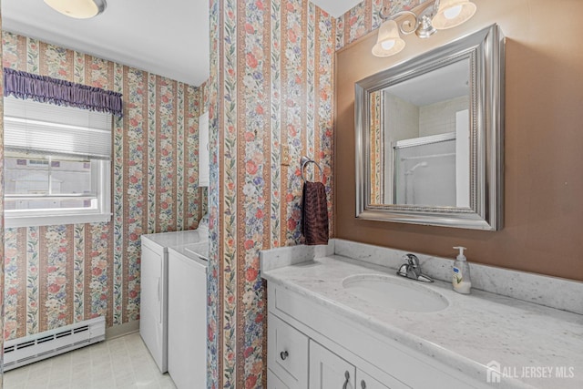 195 Mayflower Way Unit B, Monroe, NJ 08831 - bathroom with washer and dryer, wallpapered walls, baseboard heating, and vanity