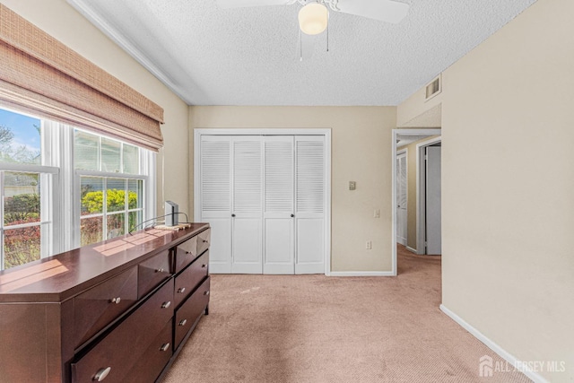 195 Mayflower Way Unit B, Monroe, NJ 08831 - bedroom featuring light colored carpet, a textured ceiling, baseboards, visible vents, and a closet