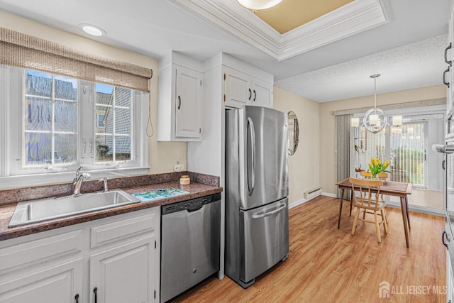 195 Mayflower Way Unit B, Monroe, NJ 08831 - kitchen featuring a sink, a baseboard heating unit, a healthy amount of sunlight, and stainless steel appliances