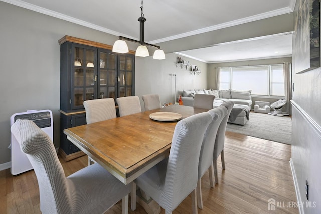 56 3rd Ave, Port Reading, NJ 07064 - dining space featuring wood finished floors and crown molding