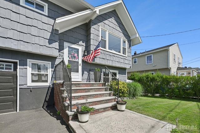 56 3rd Ave, Port Reading, NJ 07064 - doorway to property featuring a lawn