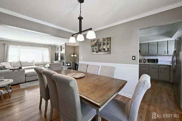 56 3rd Ave, Port Reading, NJ 07064 - dining space featuring ornamental molding and wood finished floors