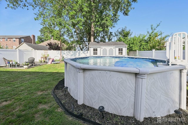 56 3rd Ave, Port Reading, NJ 07064 - view of pool with a fenced backyard and a storage unit