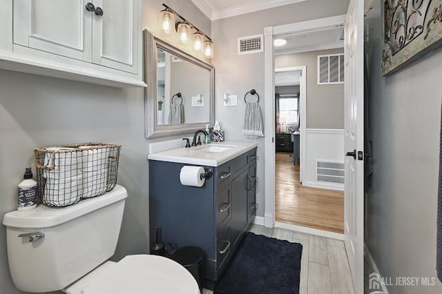 56 3rd Ave, Port Reading, NJ 07064 - bathroom featuring ornamental molding, vanity, and wood finished floors