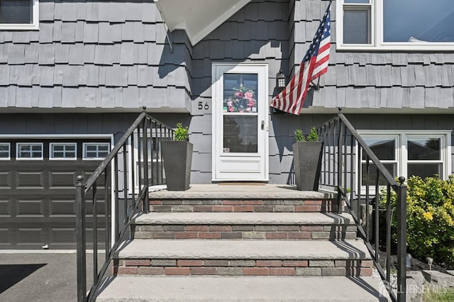 56 3rd Ave, Port Reading, NJ 07064 - view of exterior entry featuring a garage