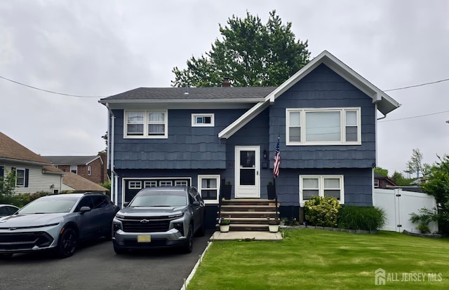 56 3rd Ave, Port Reading, NJ 07064 - split foyer home with an attached garage, a chimney, and entry steps