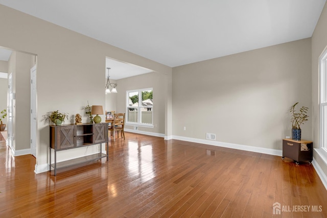 51 N Smith St, Avenel, NJ 07001 - living area featuring wood finished floors and a chandelier