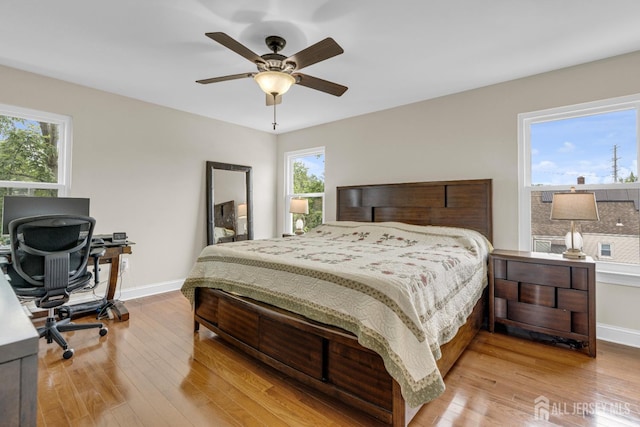 51 N Smith St, Avenel, NJ 07001 - bedroom featuring multiple windows, wood finished floors, and an office area