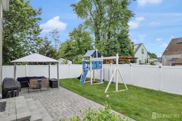 51 N Smith St, Avenel, NJ 07001 - fenced backyard with a playground and a patio area