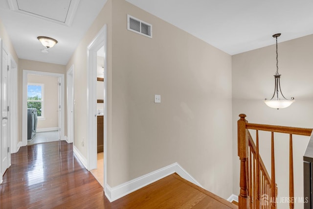 51 N Smith St, Avenel, NJ 07001 - hallway with an upstairs landing, wood finished floors, and washer / clothes dryer