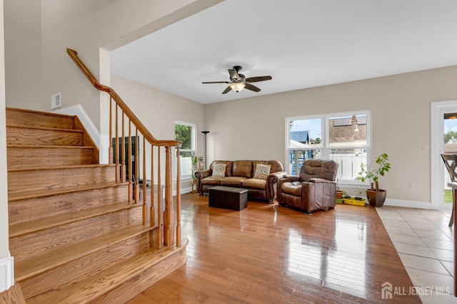 51 N Smith St, Avenel, NJ 07001 - living area featuring stairway, a ceiling fan, and light wood-style flooring