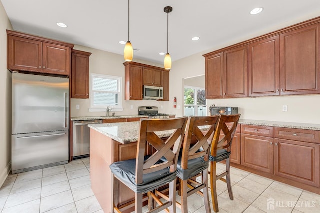 51 N Smith St, Avenel, NJ 07001 - kitchen featuring stainless steel appliances, healthy amount of natural light, recessed lighting, light tile patterned floors, and a kitchen island