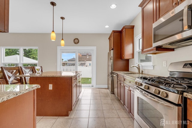 51 N Smith St, Avenel, NJ 07001 - kitchen featuring stainless steel appliances, a kitchen island, light stone countertops, and recessed lighting