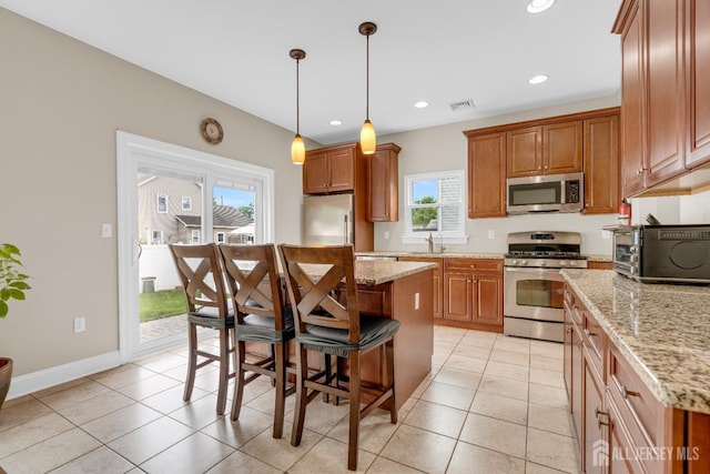 51 N Smith St, Avenel, NJ 07001 - kitchen with stainless steel appliances, plenty of natural light, a center island, a kitchen breakfast bar, and recessed lighting