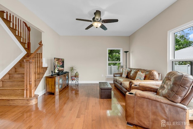 51 N Smith St, Avenel, NJ 07001 - living area featuring stairs, wood-type flooring, and a ceiling fan