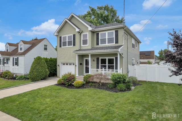 51 N Smith St, Avenel, NJ 07001 - traditional-style home with covered porch, an attached garage, and driveway