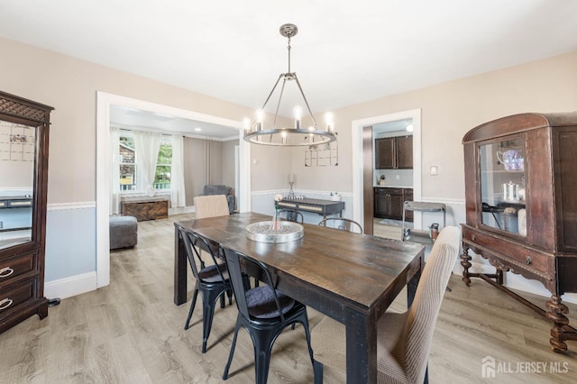 1402 Glenwood Dr, Piscataway, NJ 08854 - dining space featuring a chandelier, light wood-style floors, and baseboards