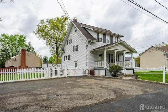 1402 Glenwood Dr, Piscataway, NJ 08854 - view of front of house featuring a porch, a chimney, a gate, and a shingled roof