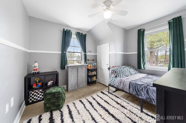 1402 Glenwood Dr, Piscataway, NJ 08854 - bedroom featuring wood finished floors, lofted ceiling, a ceiling fan, and baseboards