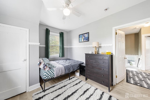 1402 Glenwood Dr, Piscataway, NJ 08854 - bedroom with wood finished floors, baseboards, and a ceiling fan