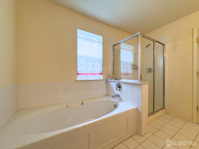 315 Birch Ct, New Brunswick, NJ 08901 - bathroom featuring tile patterned flooring, a bath, and a stall shower