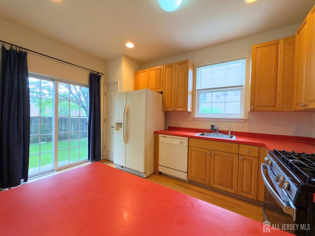 315 Birch Ct, New Brunswick, NJ 08901 - kitchen featuring white appliances, a sink, light wood-style floors, and recessed lighting