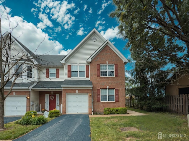 315 Birch Ct, New Brunswick, NJ 08901 - view of property featuring driveway, brick siding, and a garage