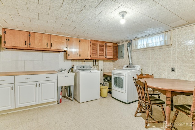 79 S Hill Rd, Colonia, NJ 07067 - laundry area featuring washing machine and dryer, cabinet space, tile walls, light floors, and electric panel