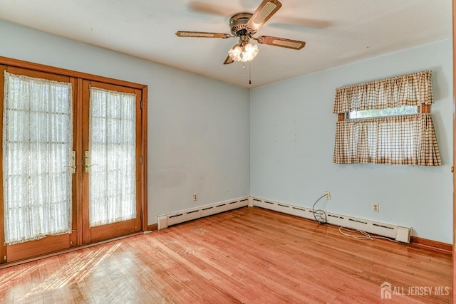 79 S Hill Rd, Colonia, NJ 07067 - empty room featuring wood finished floors, a ceiling fan, baseboards, and a baseboard heating unit