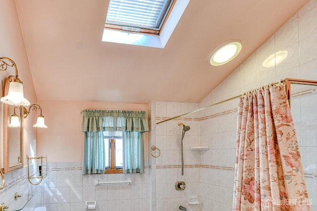 79 S Hill Rd, Colonia, NJ 07067 - bathroom with lofted ceiling, tile walls, a skylight, and shower / bath combo