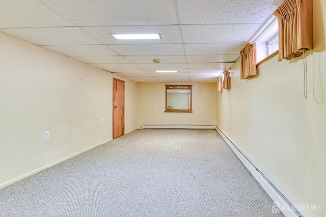 79 S Hill Rd, Colonia, NJ 07067 - finished basement featuring a baseboard radiator, carpet flooring, a drop ceiling, and baseboards
