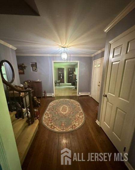 188 N Rd, Chester Twp, NJ 07930 - hall featuring wood finished floors, crown molding, a baseboard heating unit, and baseboards
