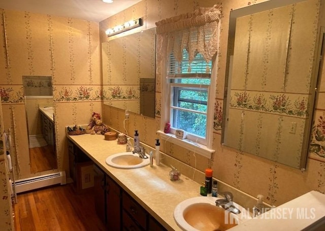 188 N Rd, Chester Twp, NJ 07930 - full bathroom with baseboard heating, wood finished floors, and double vanity