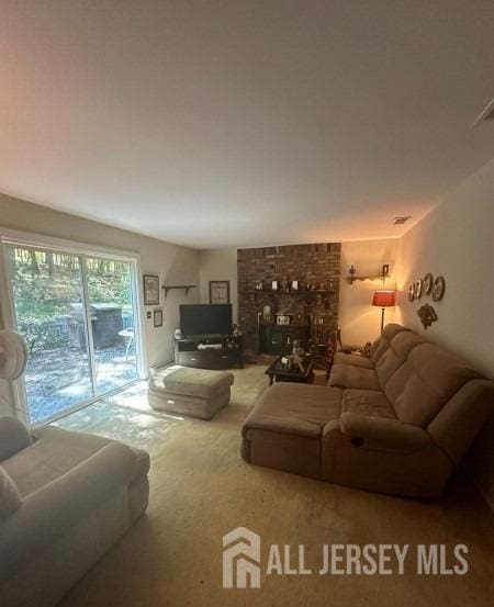 188 N Rd, Chester Twp, NJ 07930 - living area featuring carpet and a fireplace