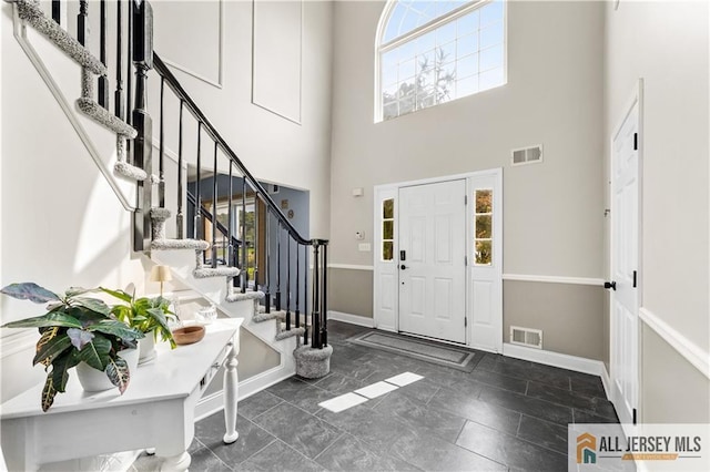 entrance foyer featuring a high ceiling