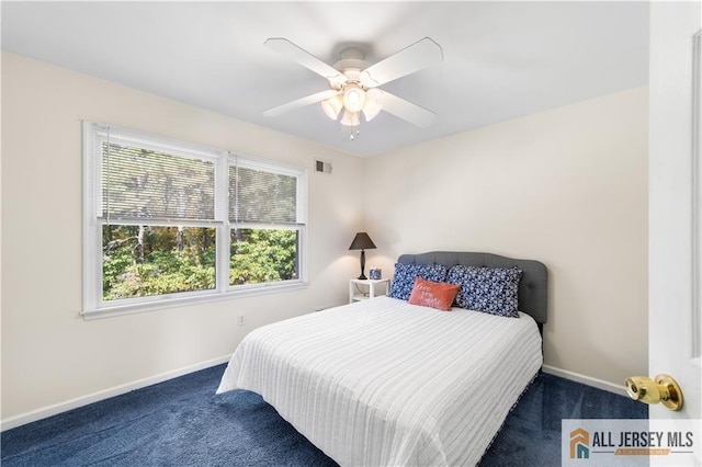 carpeted bedroom with ceiling fan