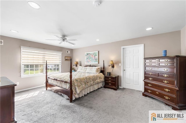 bedroom with ceiling fan and light carpet