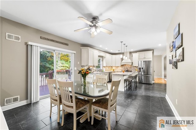 dining room featuring ceiling fan